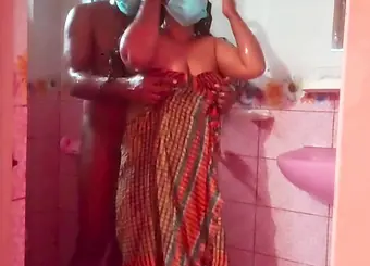 Desi aunty in Bangladesh enjoys steamy shower sex while bathing