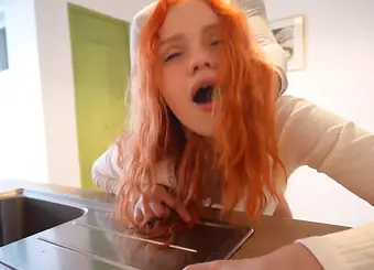 Scorching teenie with crimson hair gets her cock-squeezing cooch pummeled stiff in the kitchen